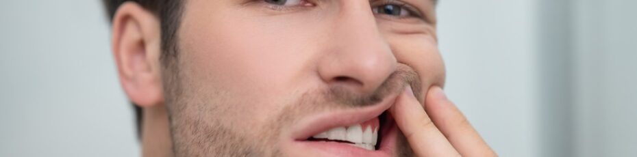 man suffering from gum disease