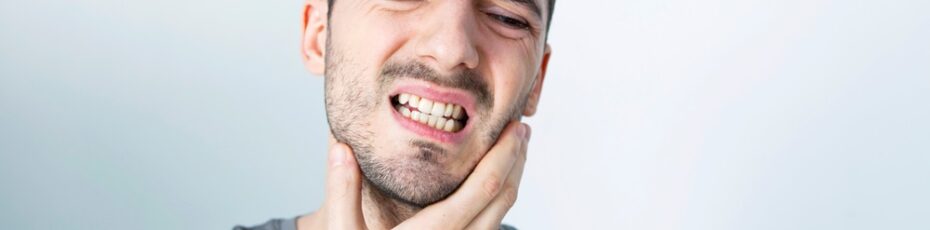 man seeking for emergency dentist