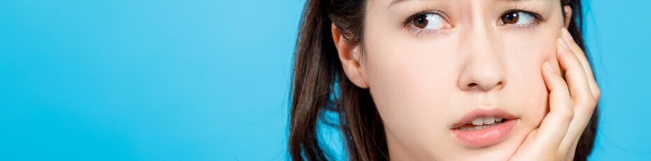 woman suffering from teeth pain