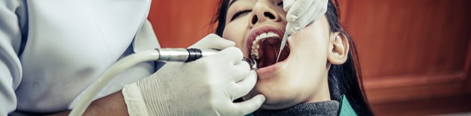 dentist performing root canal treatment